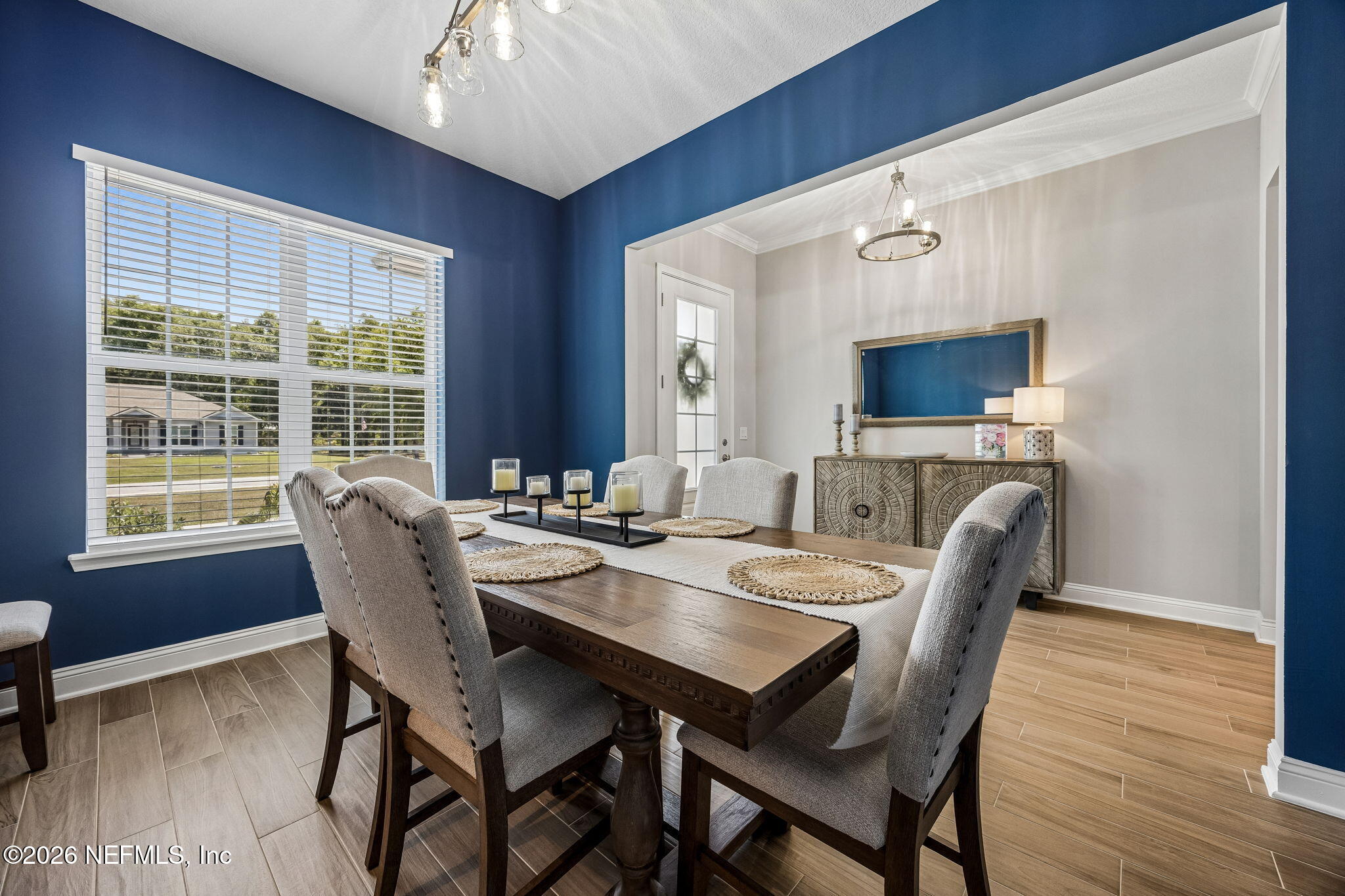 85949 Miner Pines Yulee, FL 32097 - Photo 15 of 55 a view of a dining room with furniture window and wooden floor