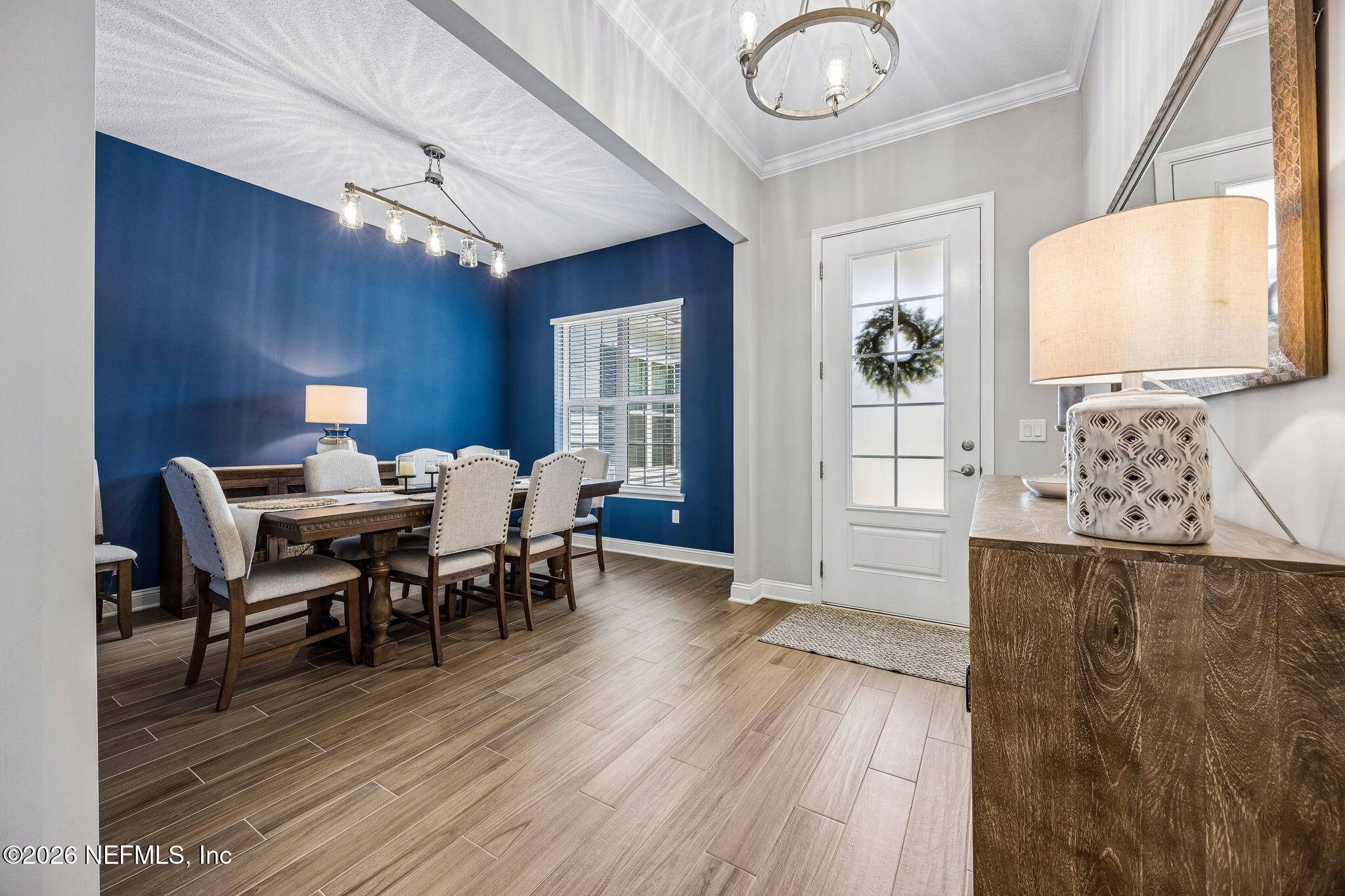 85949 Miner Pines Yulee, FL 32097 - Photo 16 of 55 a view of a dining room with furniture and wooden floor