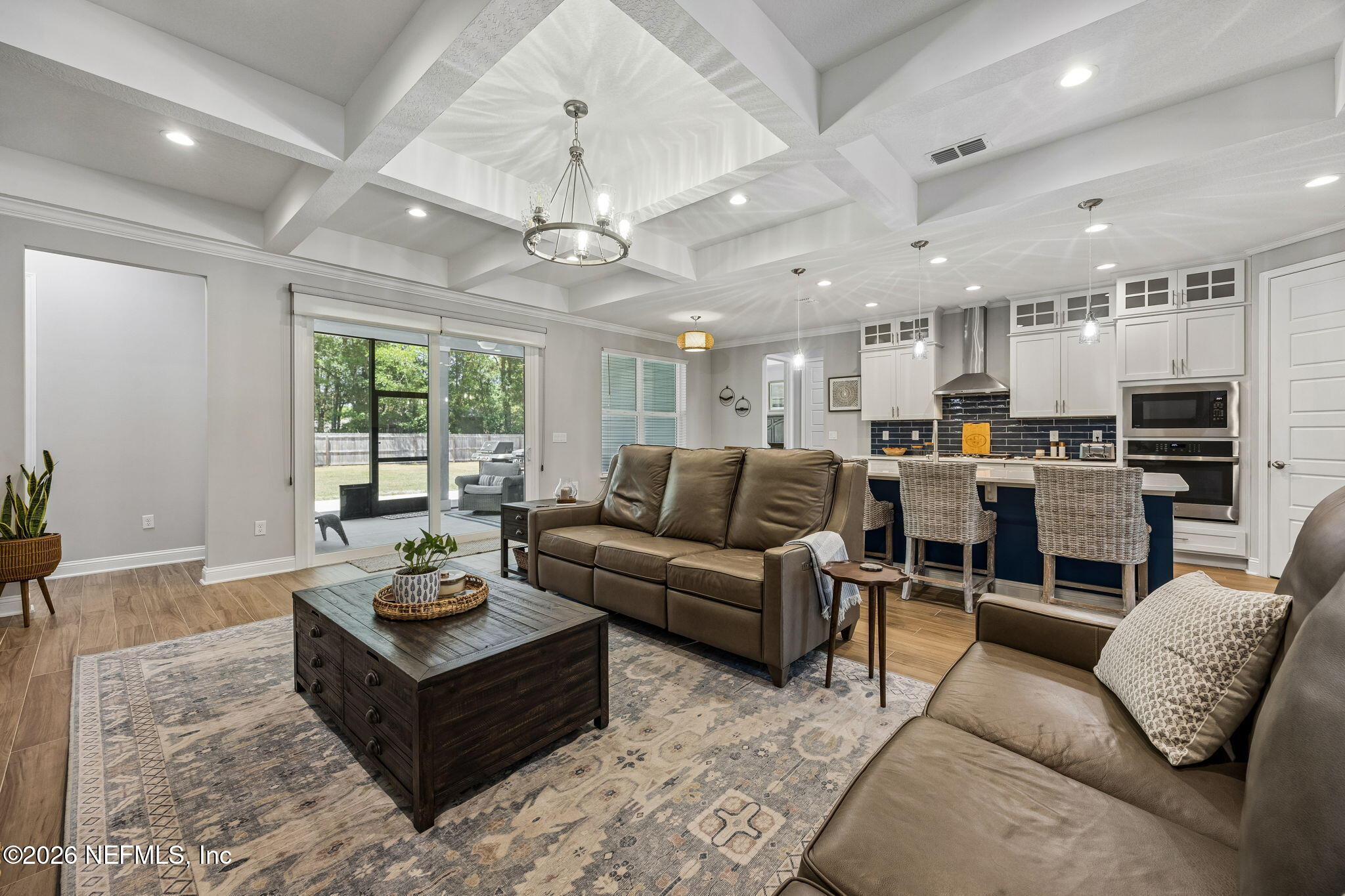 85949 Miner Pines Yulee, FL 32097 - Photo 55 of 55 a living room with furniture kitchen view and a chandelier
