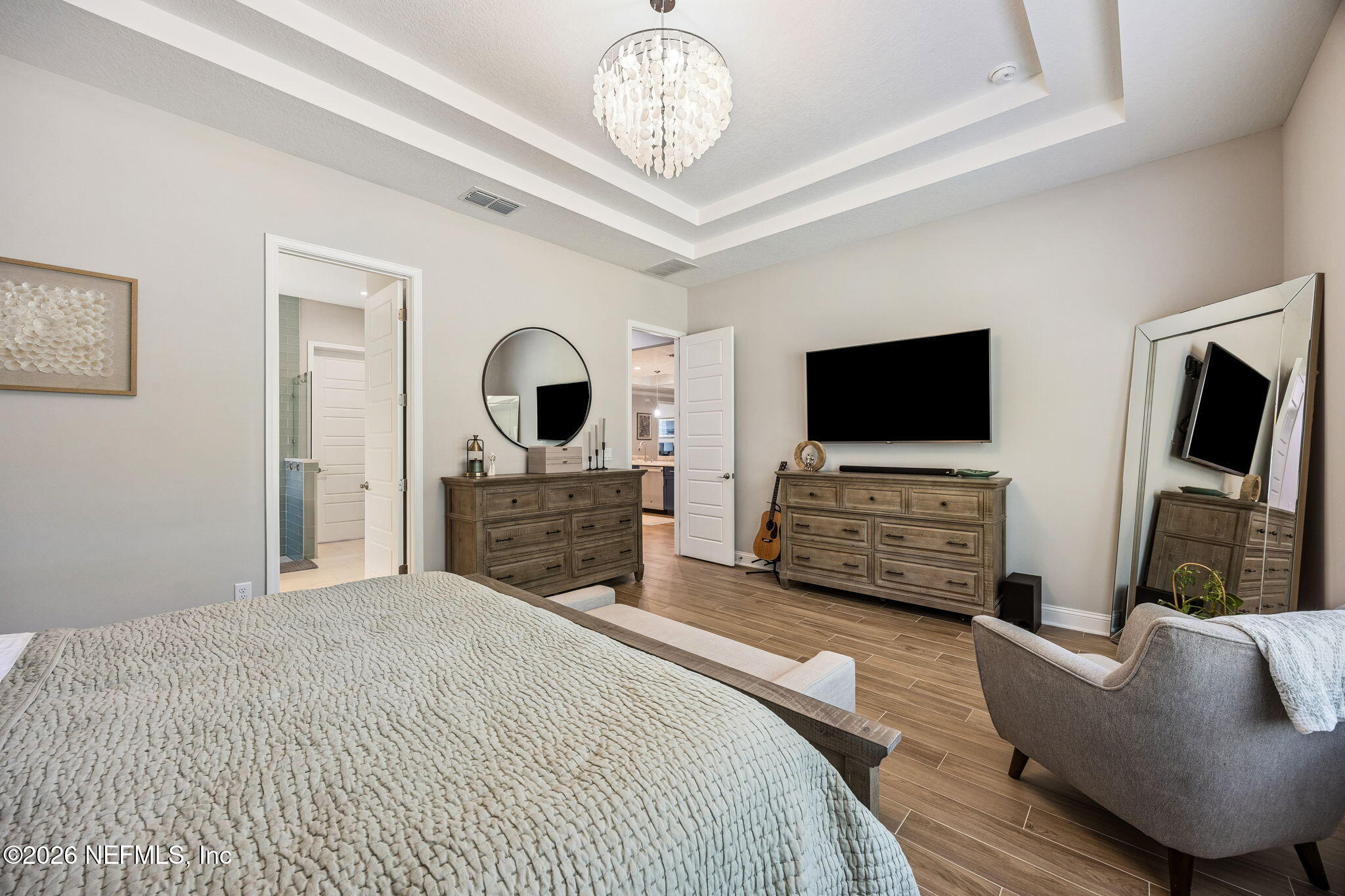 85949 Miner Pines Yulee, FL 32097 - Photo 20 of 55 a bedroom with a bed and a flat screen tv