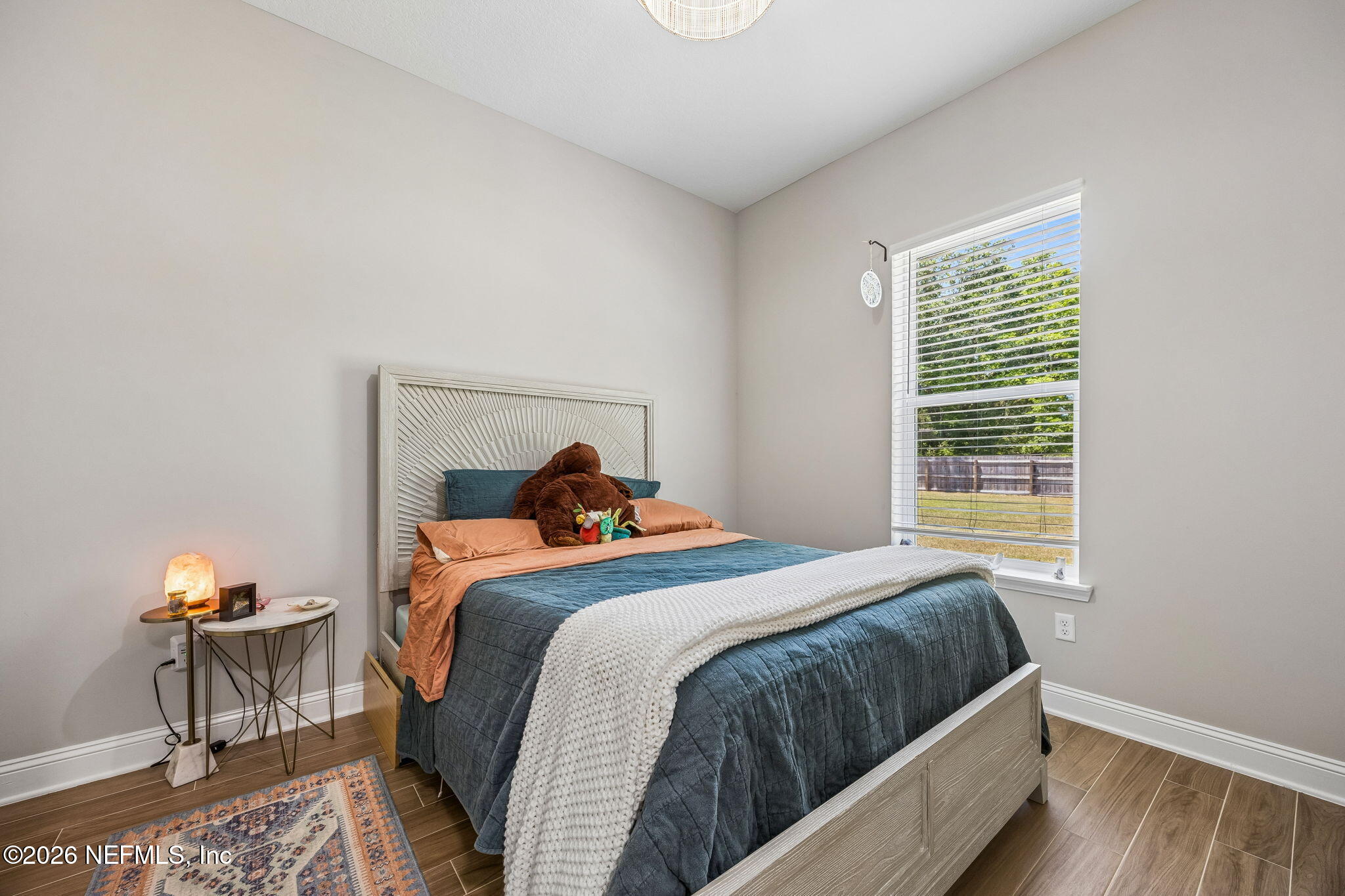 85949 Miner Pines Yulee, FL 32097 - Photo 24 of 55 a bedroom with a bed and a window
