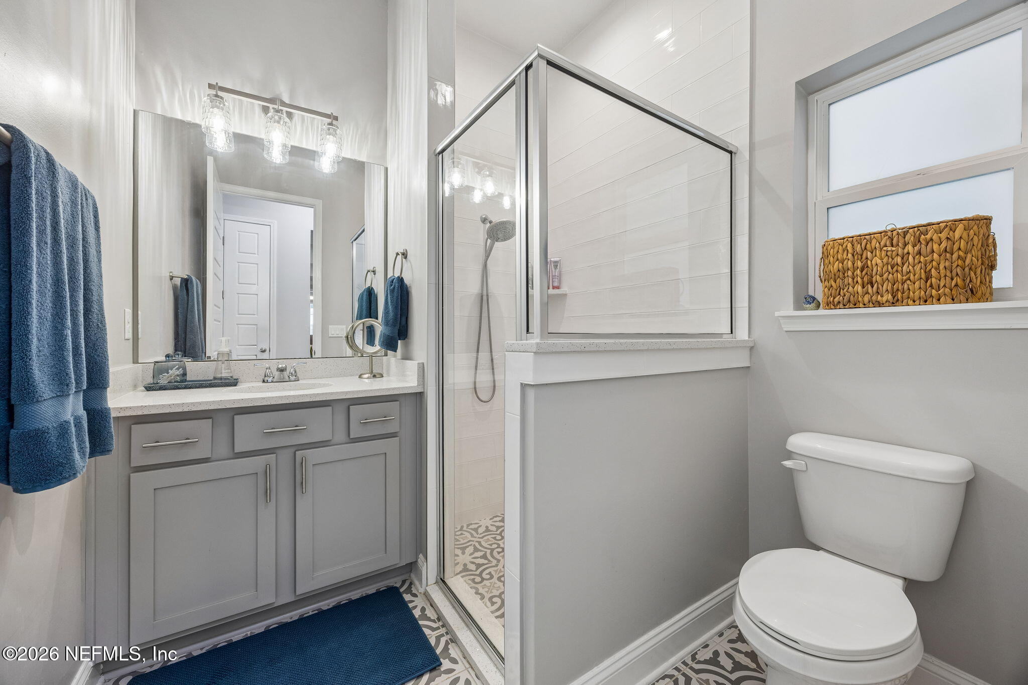 85949 Miner Pines Yulee, FL 32097 - Photo 26 of 55 a bathroom with a toilet a sink a vanity and mirror