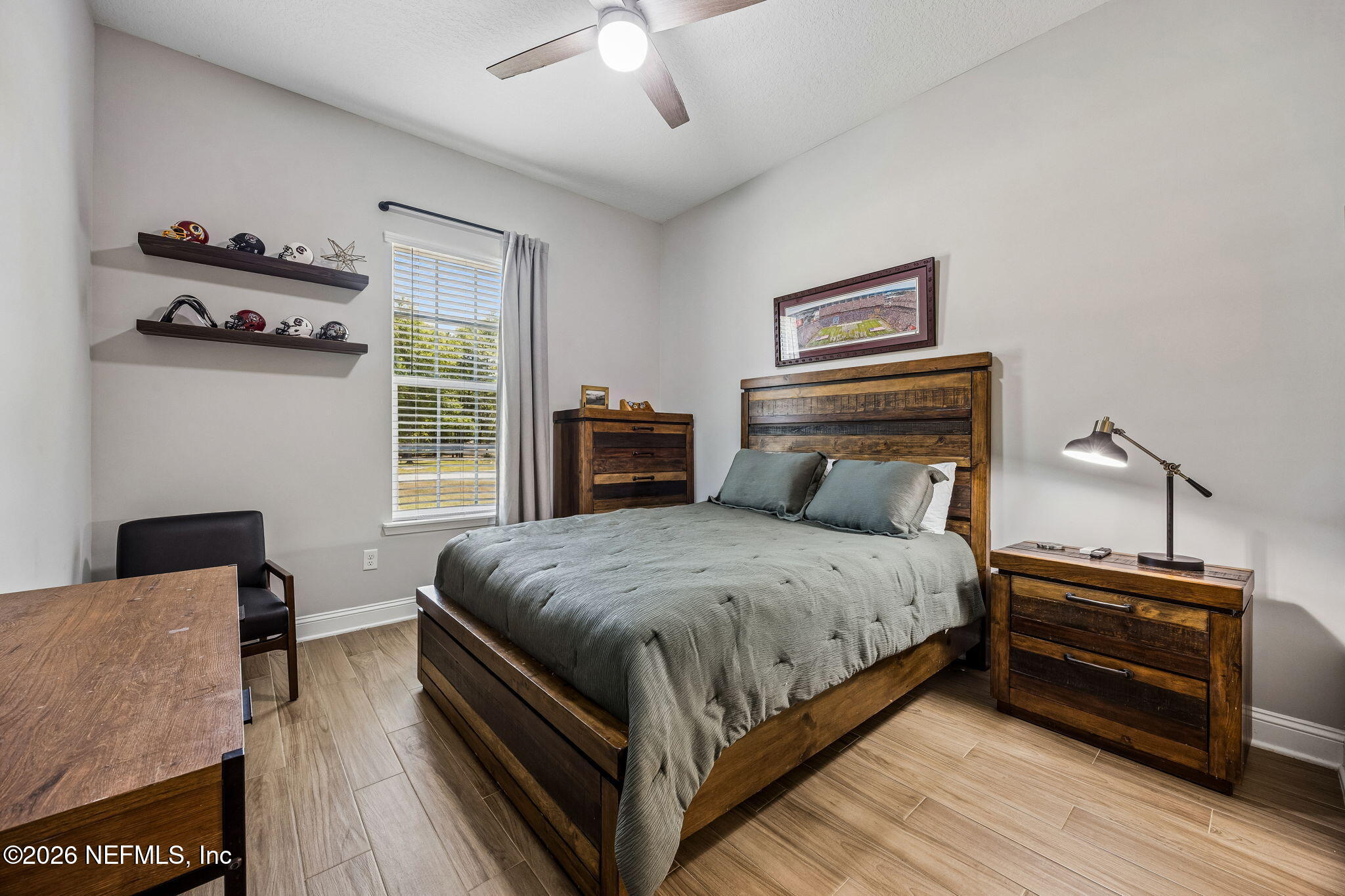 85949 Miner Pines Yulee, FL 32097 - Photo 27 of 55 a bedroom with a bed and a tv