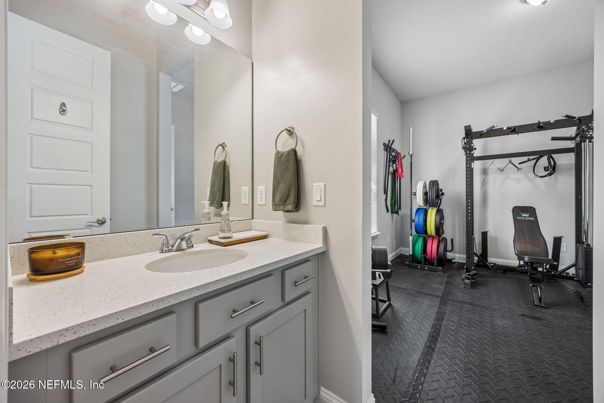 85949 Miner Pines Yulee, FL 32097 - Photo 33 of 55 a bathroom with a sink double vanity and mirror
