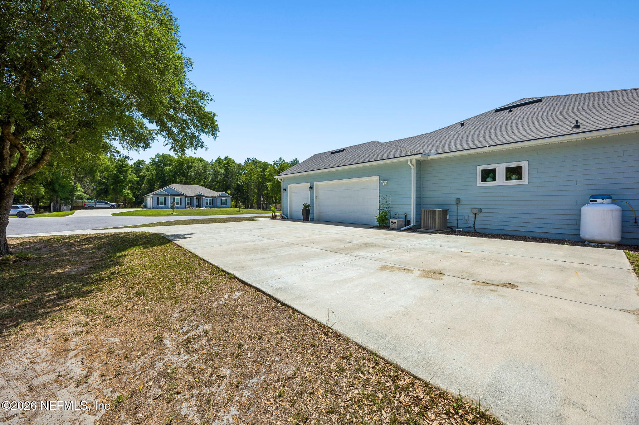 85949 Miner Pines Yulee, FL 32097 - Photo 37 of 55 a front view of a house with a yard