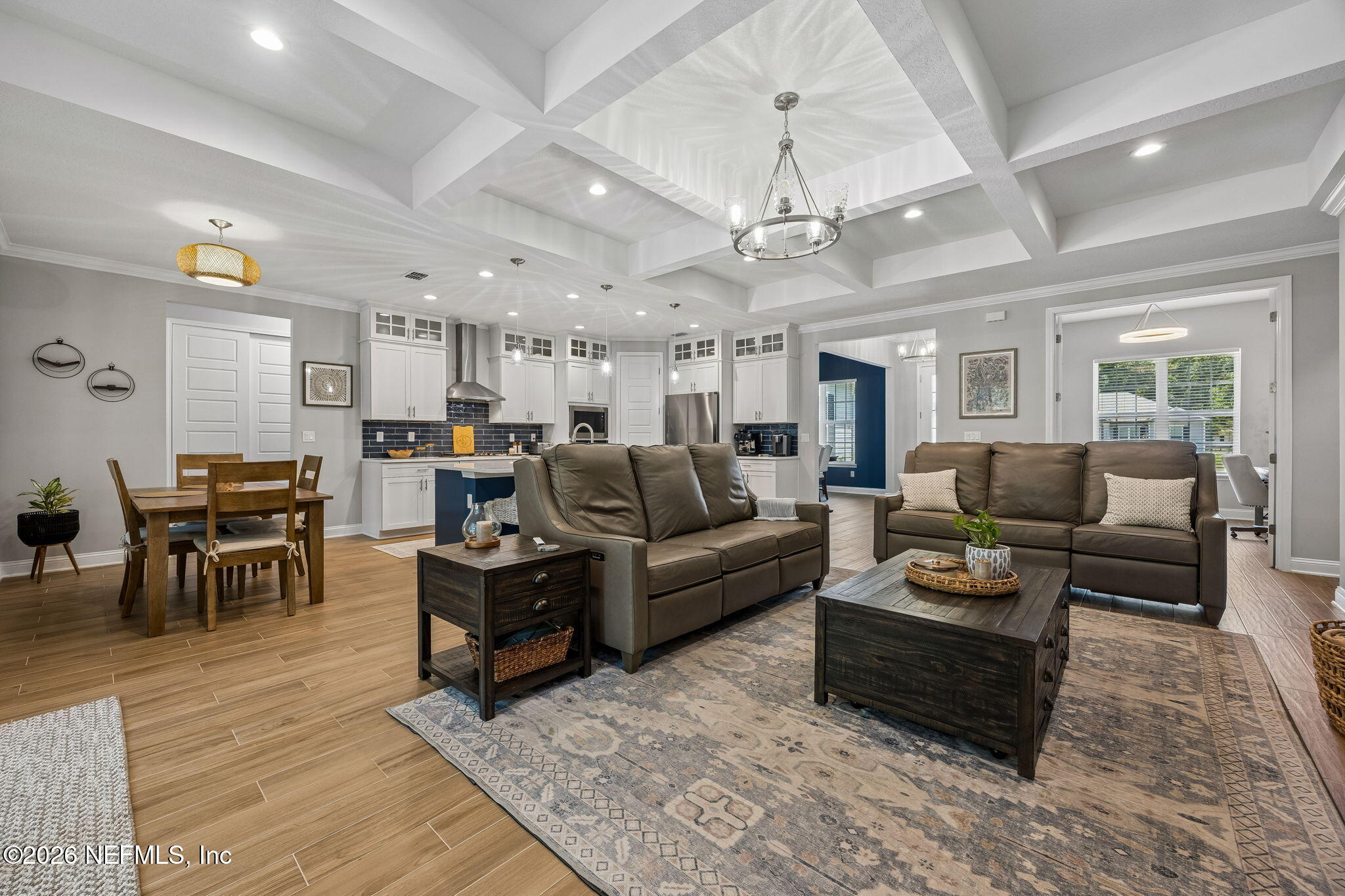 85949 Miner Pines Yulee, FL 32097 - Photo 3 of 55 a living room with furniture kitchen view and a chandelier