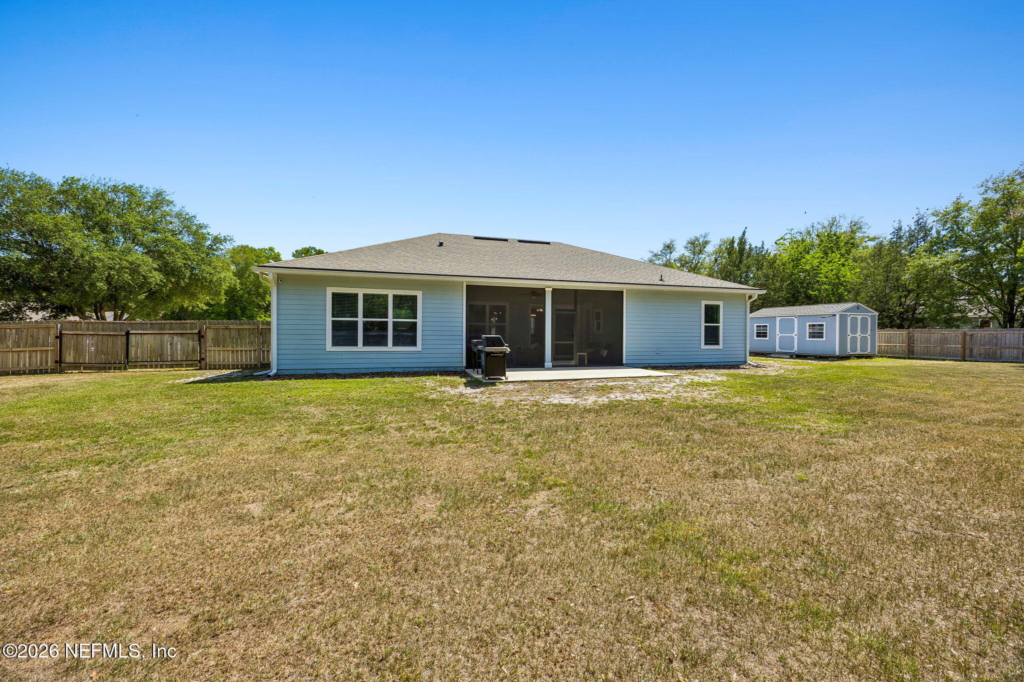 85949 Miner Pines Yulee, FL 32097 - Photo 44 of 55 a view of a house with a backyard