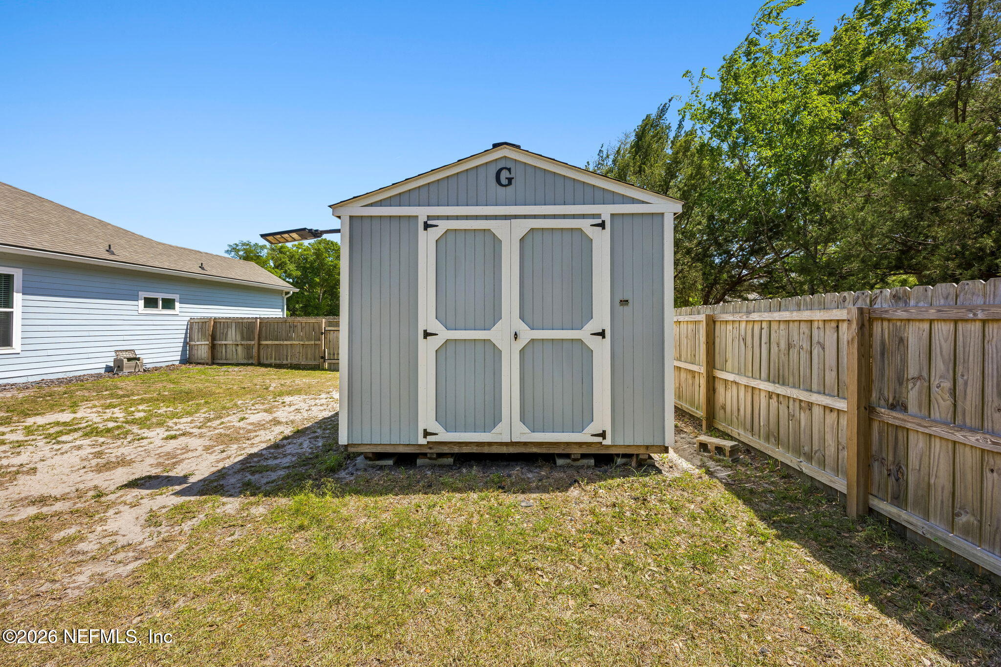 85949 Miner Pines Yulee, FL 32097 - Photo 46 of 55 a front view of a house with a yard
