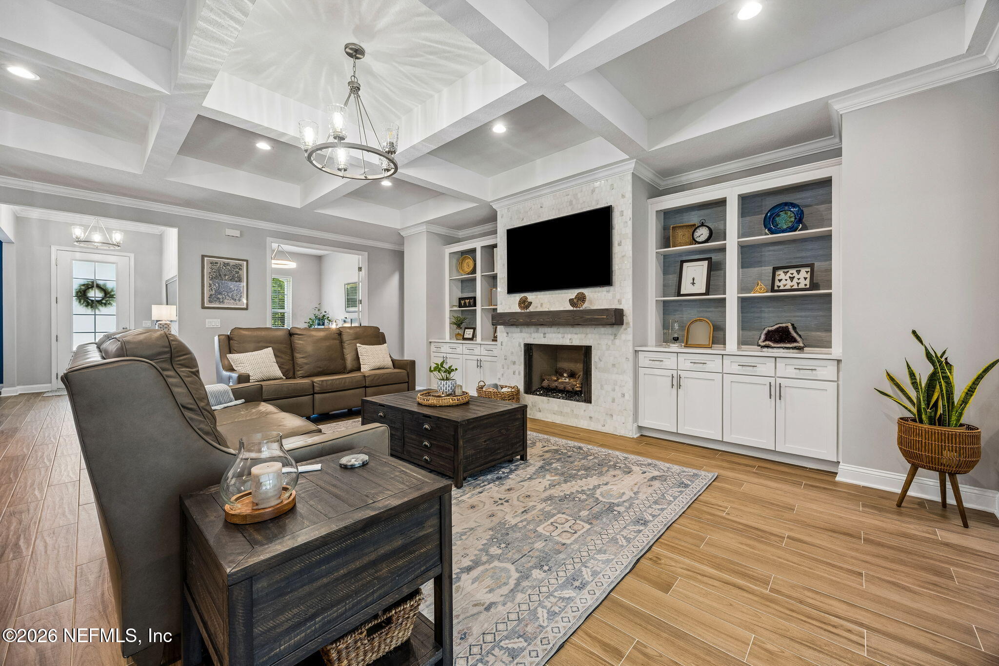 85949 Miner Pines Yulee, FL 32097 - Photo 4 of 55 a living room with furniture a fireplace and a flat screen tv