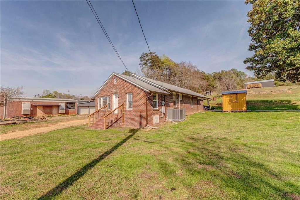 21 School Street Northeast Rydal, GA 30171 - Photo 1 of 44 a front view of a house with a big yard