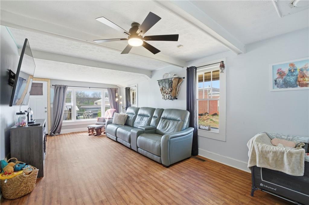 21 School Street Northeast Rydal, GA 30171 - Photo 11 of 44 a living room with furniture and a large window