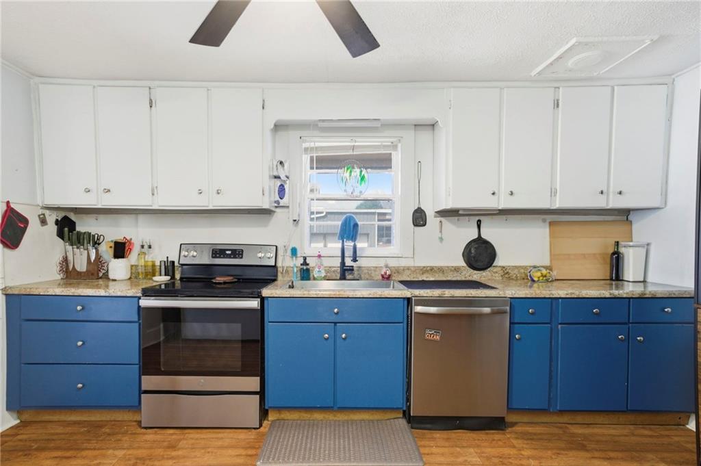 21 School Street Northeast Rydal, GA 30171 - Photo 17 of 44 a kitchen with a cabinets and white appliances