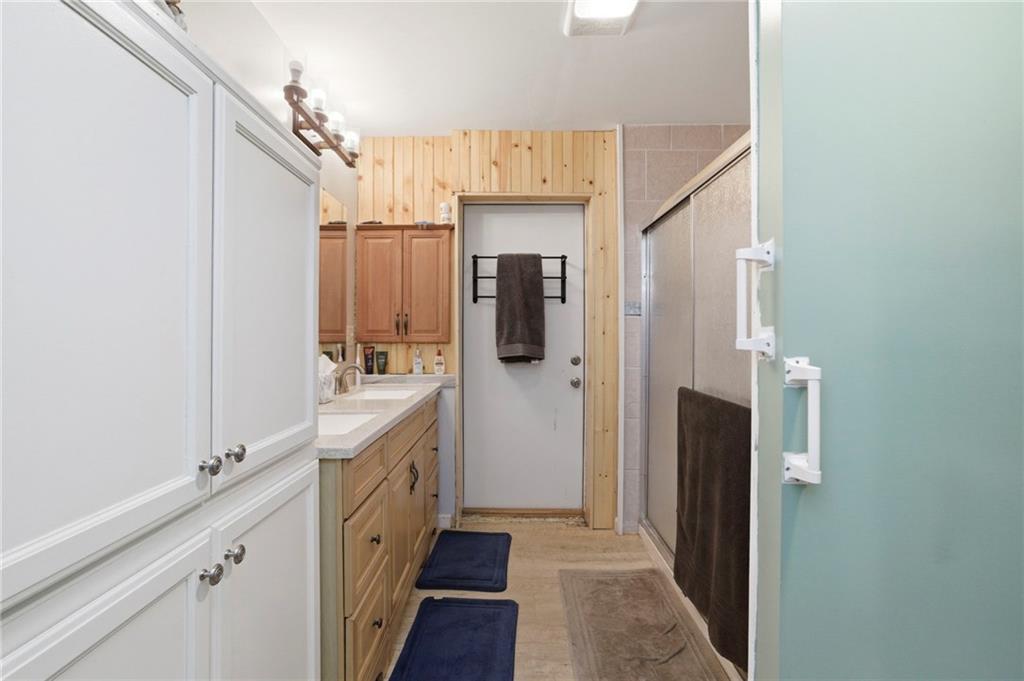21 School Street Northeast Rydal, GA 30171 - Photo 21 of 44 a bathroom with a double vanity sink and mirror