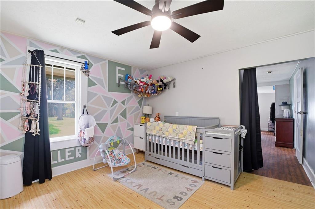 21 School Street Northeast Rydal, GA 30171 - Photo 27 of 44 a bedroom with furniture and a window