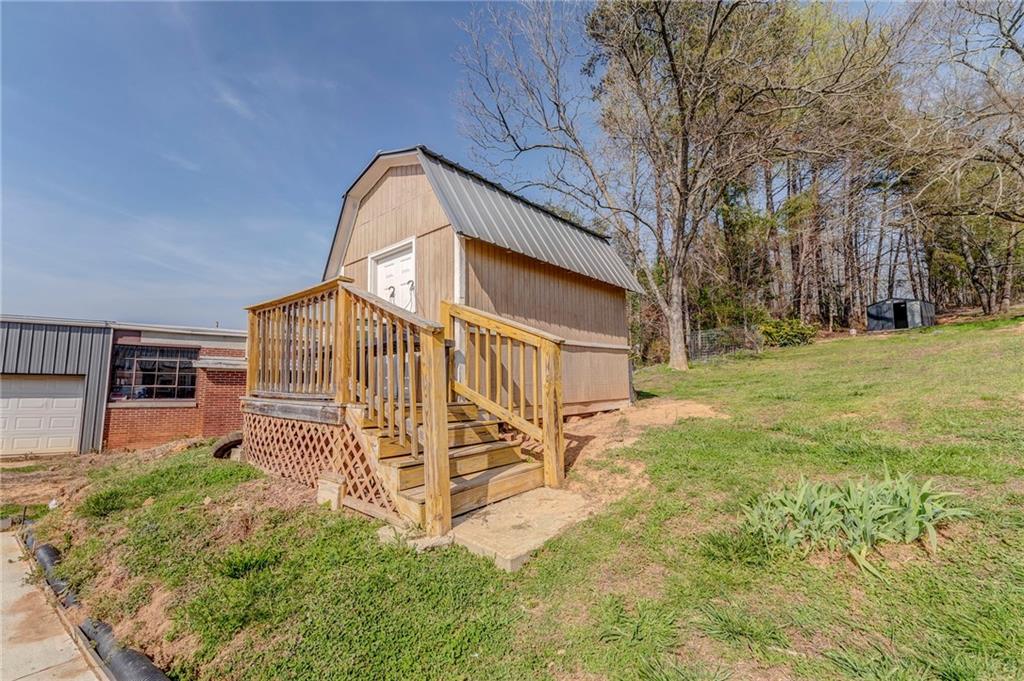 21 School Street Northeast Rydal, GA 30171 - Photo 33 of 44 a view of a house with a yard