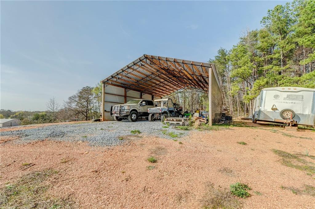 21 School Street Northeast Rydal, GA 30171 - Photo 37 of 44 a view of a house with a snow in the yard