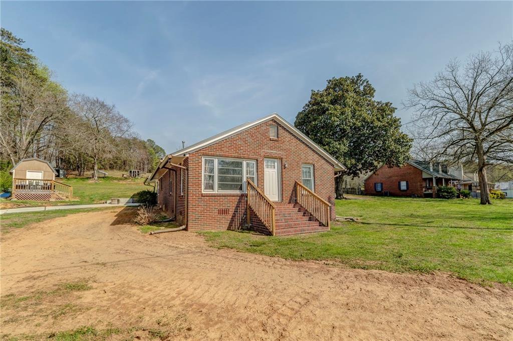 21 School Street Northeast Rydal, GA 30171 - Photo 6 of 44 a view of a house with a yard