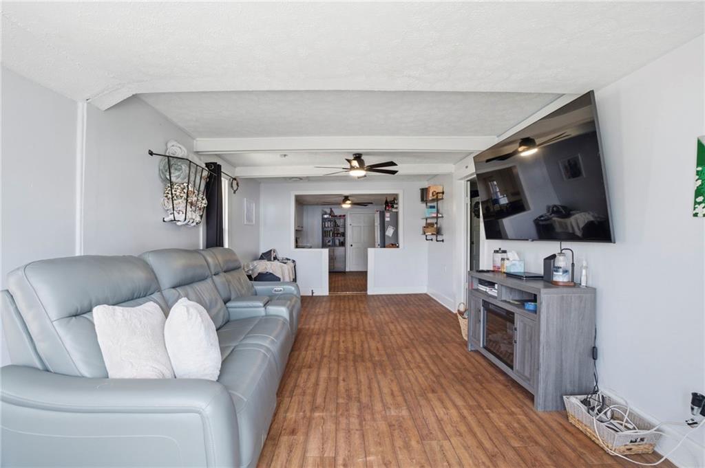 21 School Street Northeast Rydal, GA 30171 - Photo 9 of 44 a living room with furniture and a flat screen tv