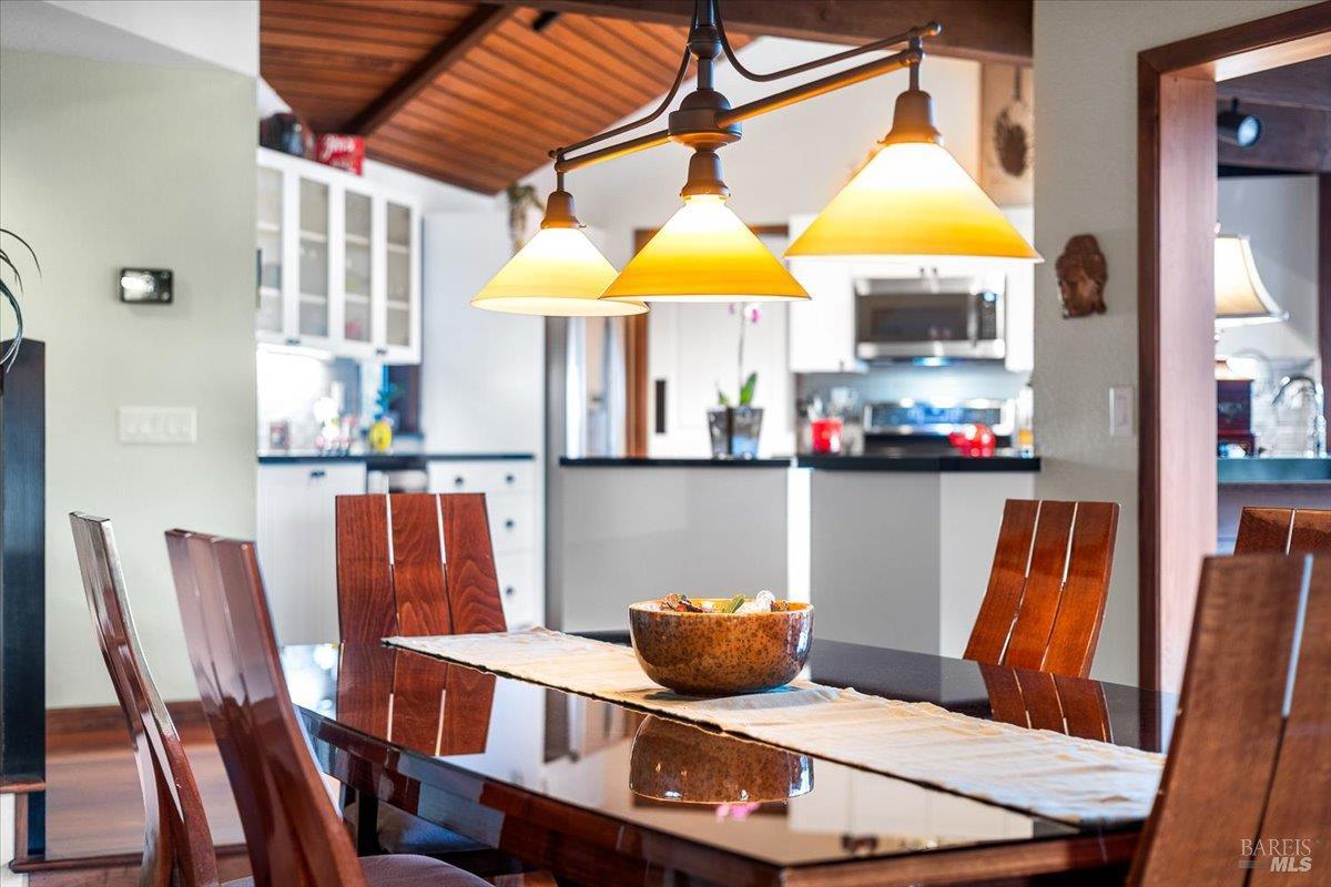 10045 Loch Haven Drive Santa Rosa, CA 95404 - Photo 11 of 37 a dining room filled with furniture and chandelier