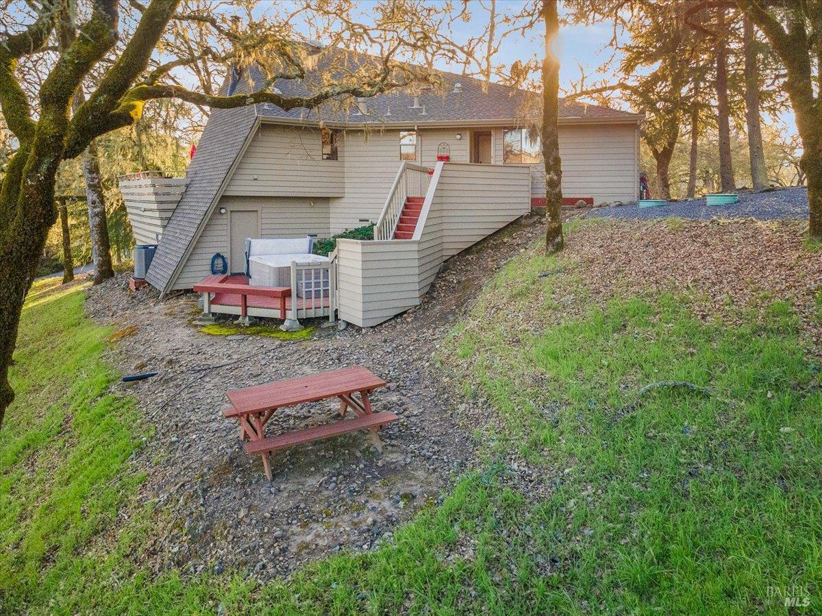 10045 Loch Haven Drive Santa Rosa, CA 95404 - Photo 30 of 37 a backyard of a house with barbeque oven table and chairs