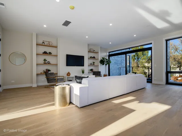 a living room with furniture flat screen tv and a fireplace