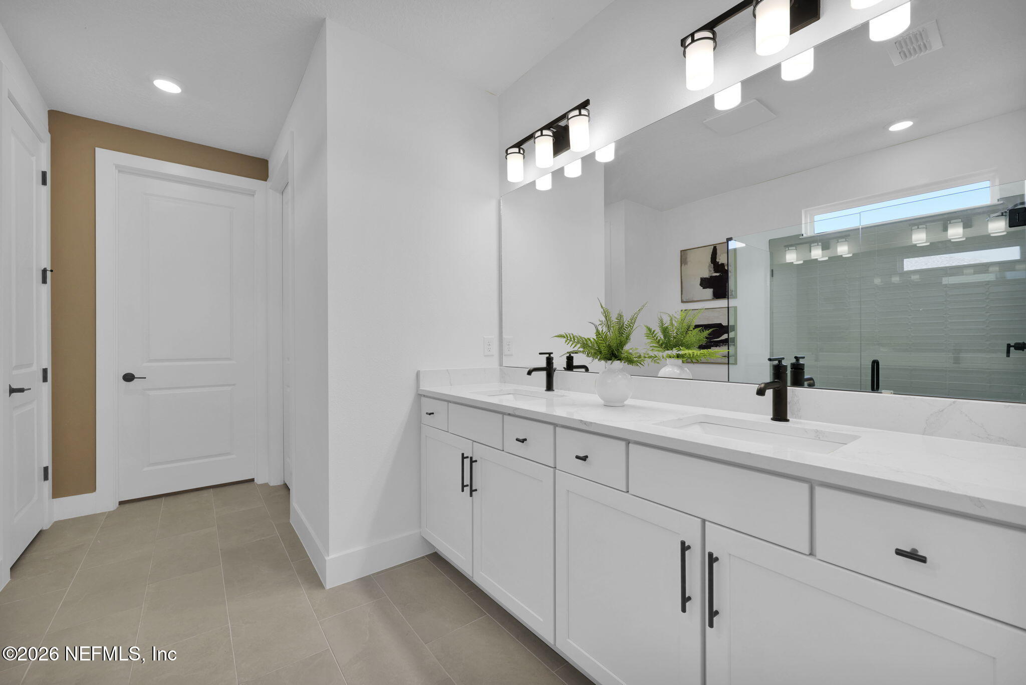 1739 Mickey Way Middleburg, FL 32068 - Photo 19 of 25 a bathroom with a double vanity sink and a mirror