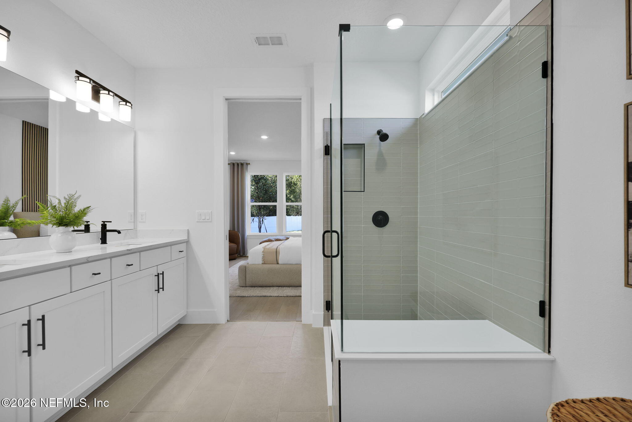 1739 Mickey Way Middleburg, FL 32068 - Photo 20 of 25 a bathroom with a double vanity sink toilet and shower