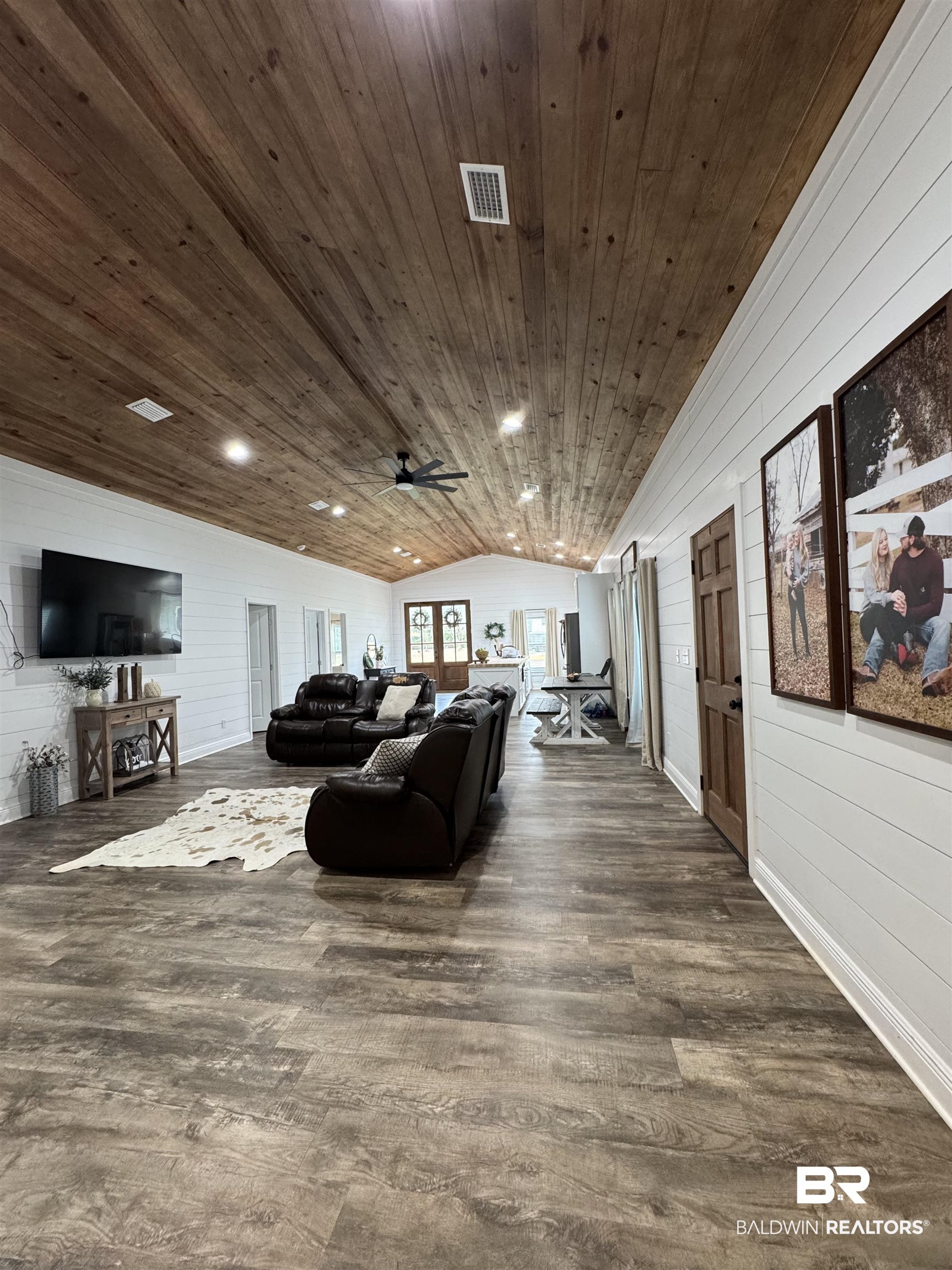 370 Dianne Road Frisco City, AL 36445 - Photo 28 of 41 Living room with lofted ceiling, dark wood-type flooring, ceiling fan, and wood ceiling