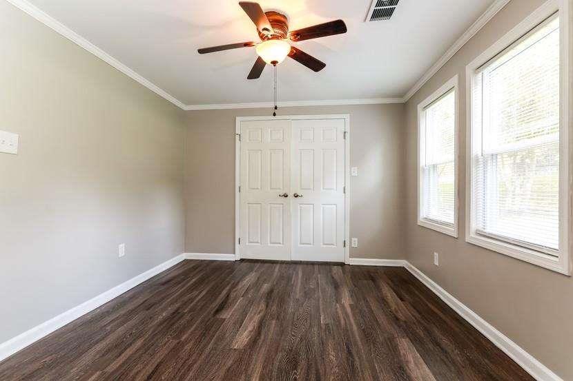 3993 Forrest Court Chamblee, GA 30341 - Photo 11 of 14 wooden floor in an empty room with a window