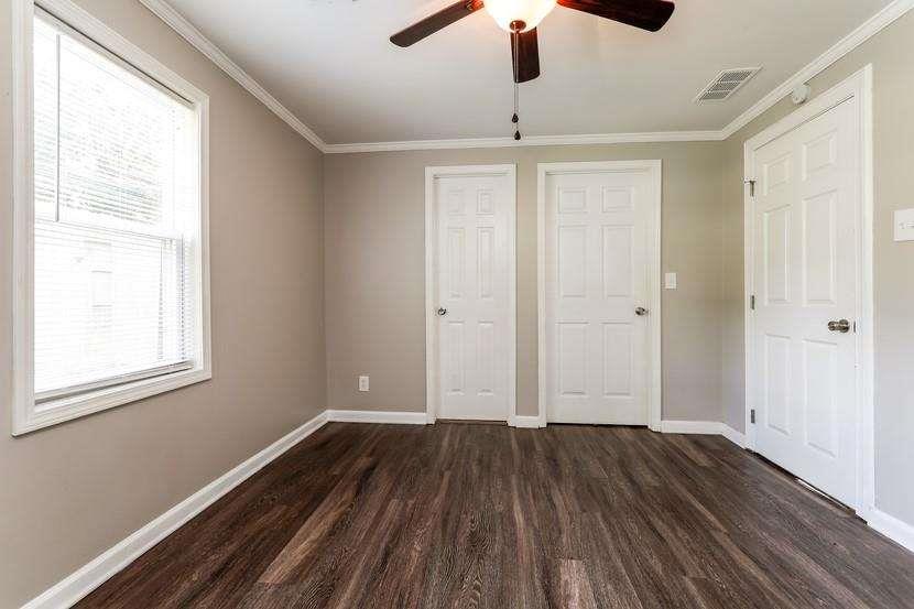 3993 Forrest Court Chamblee, GA 30341 - Photo 12 of 14 wooden floor in an empty room with a window