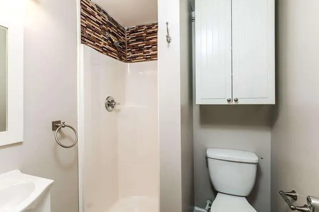 a bathroom with a toilet and a sink