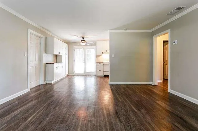a view of an empty room with a window