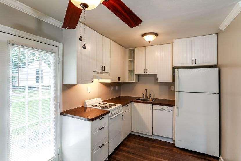3993 Forrest Court Chamblee, GA 30341 - Photo 3 of 14 a kitchen with a stove a refrigerator and a sink
