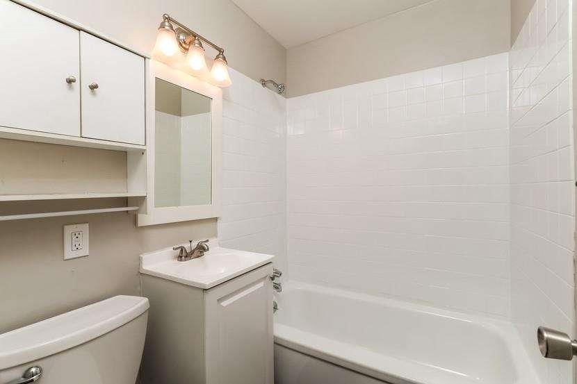 3993 Forrest Court Chamblee, GA 30341 - Photo 6 of 14 a bathroom with a sink a toilet and shower