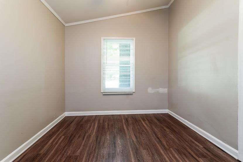 3993 Forrest Court Chamblee, GA 30341 - Photo 9 of 14 a view of a room with wooden floor and window