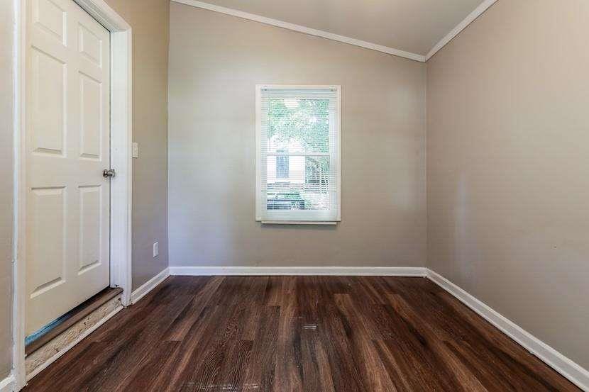 3993 Forrest Court Chamblee, GA 30341 - Photo 10 of 14 a view of an empty room with wooden floor and a window