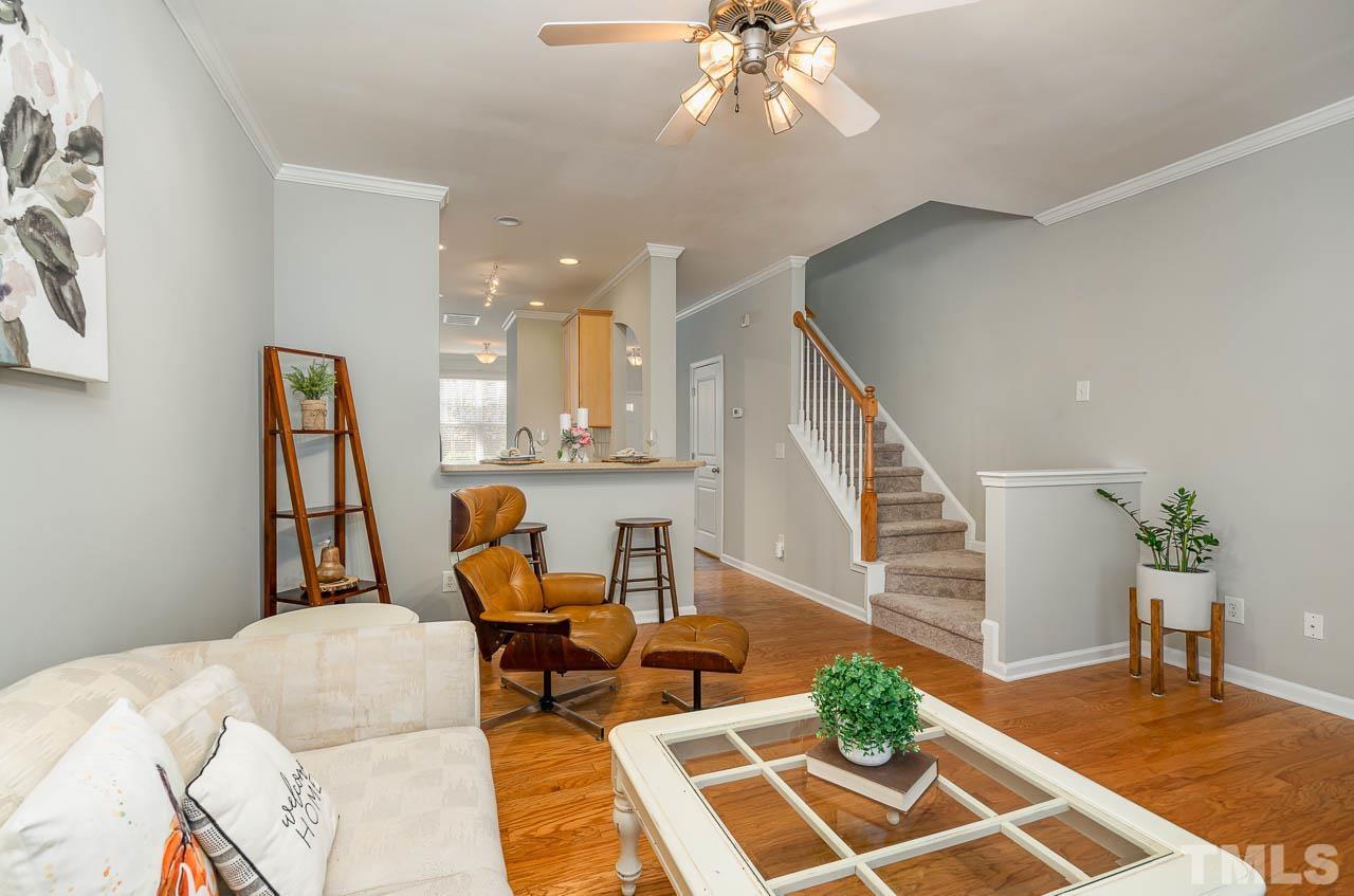 6022 Viking Drive Raleigh, NC 27612 - Photo 7 of 11 a living room with furniture and wooden floor