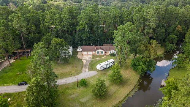 an aerial view of a house with yard