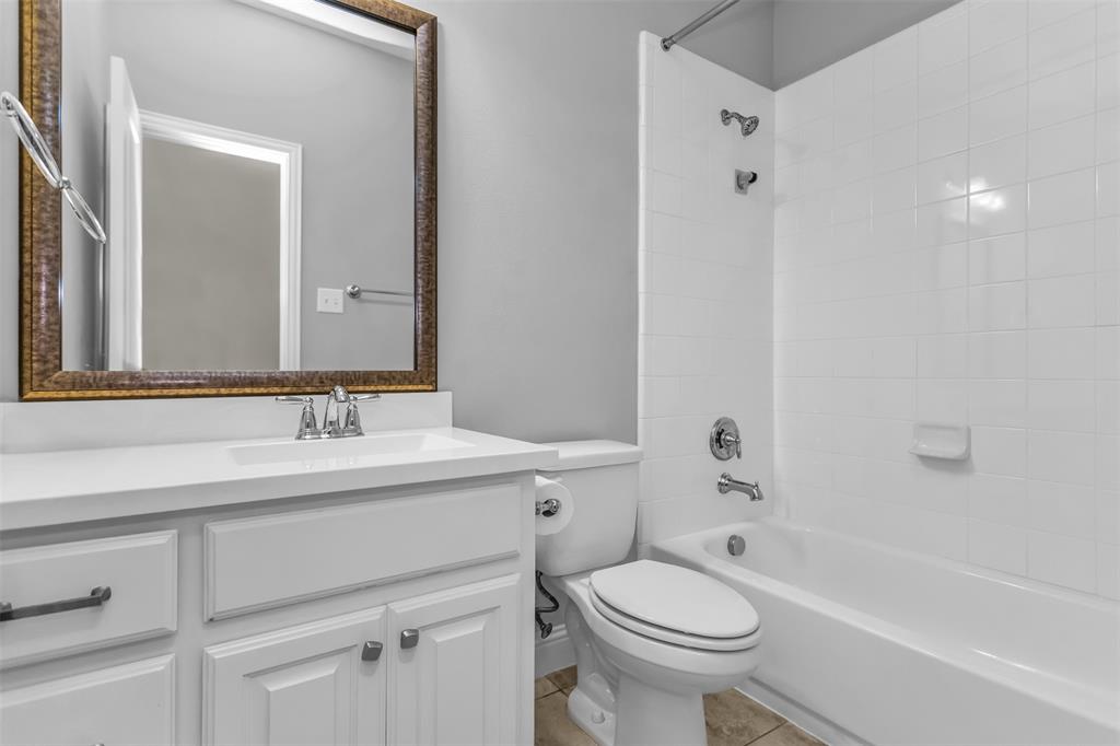 15713 Canyon Ridge Prosper, TX 75078 - Photo 6 of 38 Bathroom featuring a white vanity with integrated sink and chrome fixtures