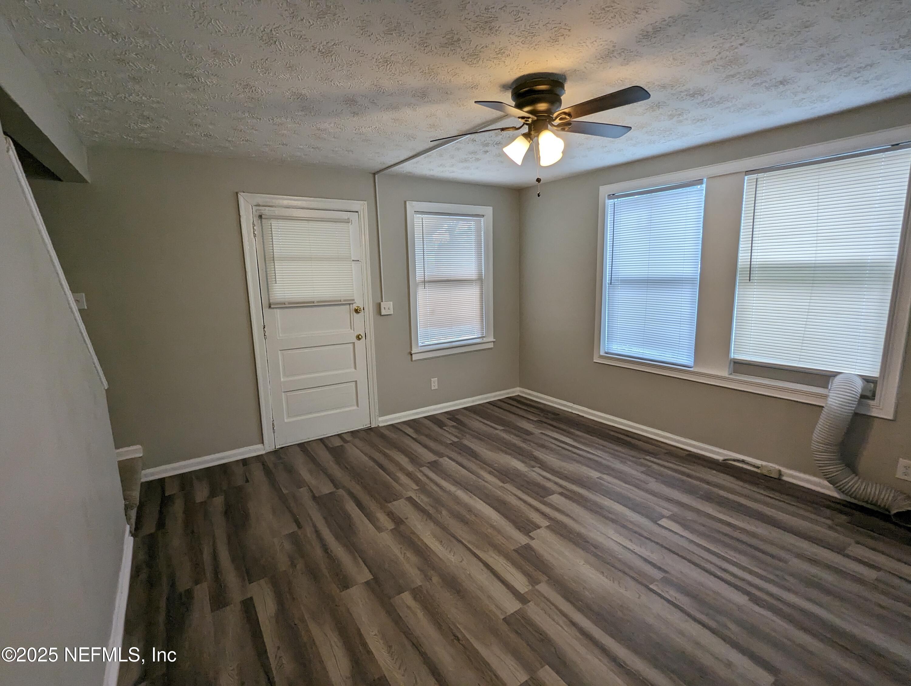 1204 Cherry Street Jacksonville, FL 32205 - Photo 22 of 32 a view of an empty room with wooden floor and a window