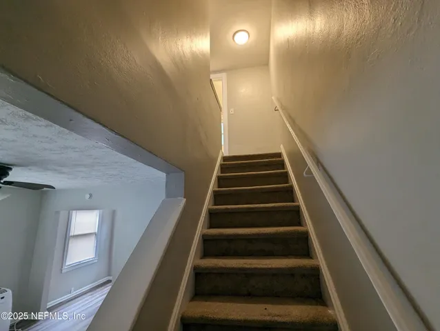 a view of hallway with closet