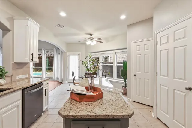 a living room with granite countertop furniture and fireplace