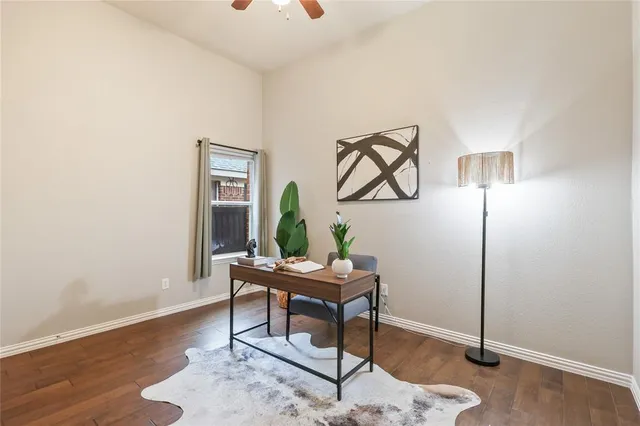 a workspace with furniture and wooden floor