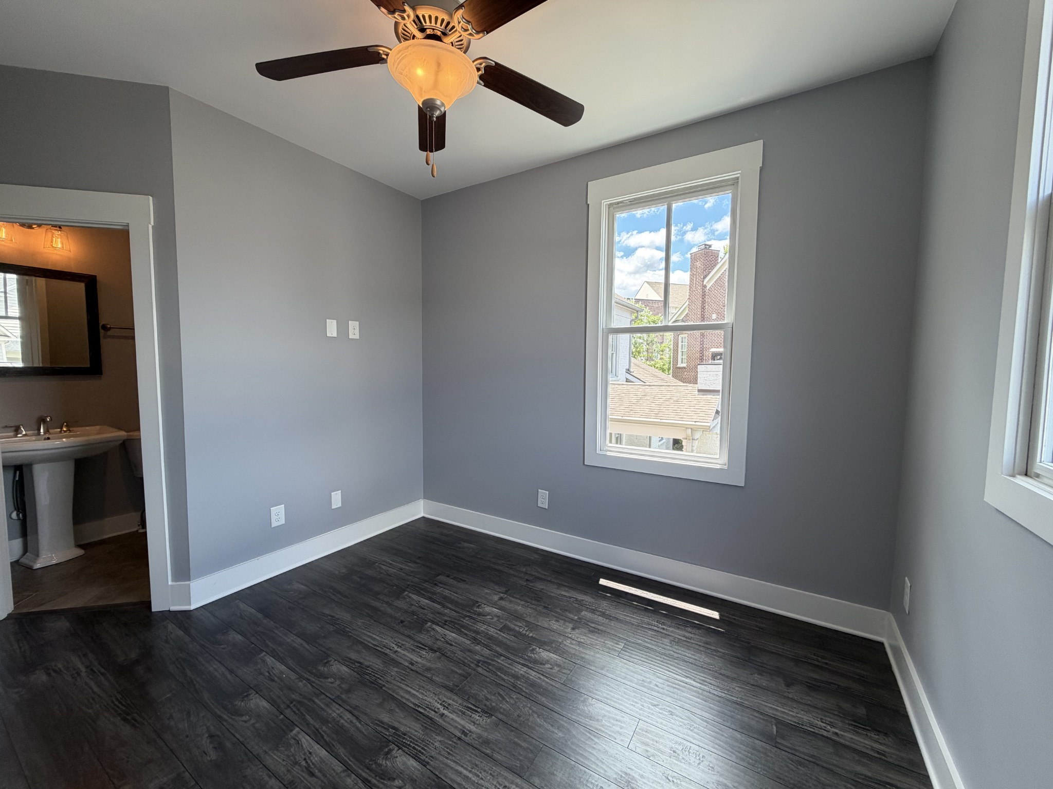 3097 Rural Plains Circle Franklin, TN 37064 - Photo 4 of 28 a view of an empty room with wooden floor and a window