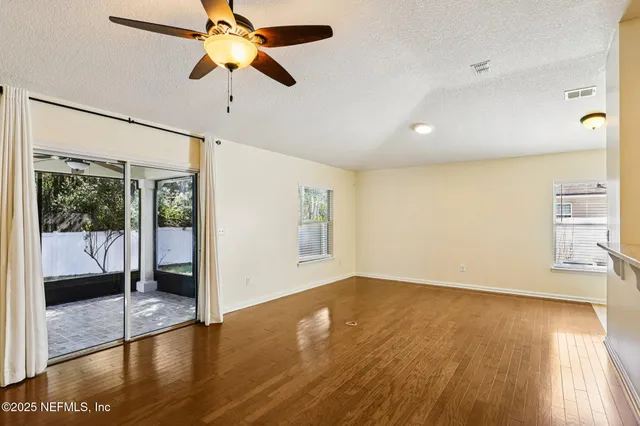 a kitchen with stainless steel appliances granite countertop a refrigerator a stove and a sink