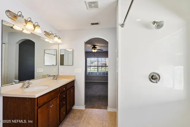 a bathroom with a toilet and a shower curtain
