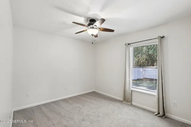 a view of a chandelier fan in a room