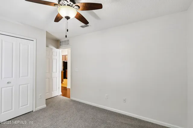 a view of a back yard from a balcony