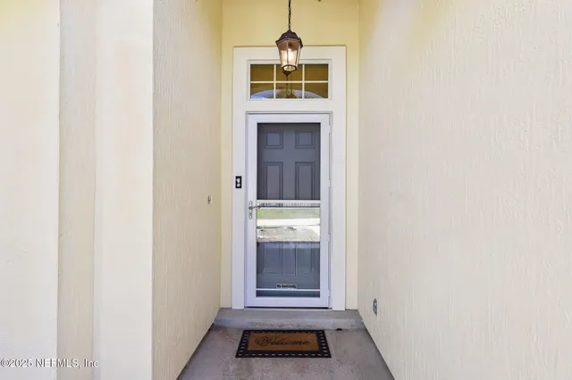 a view of a hallway with front door