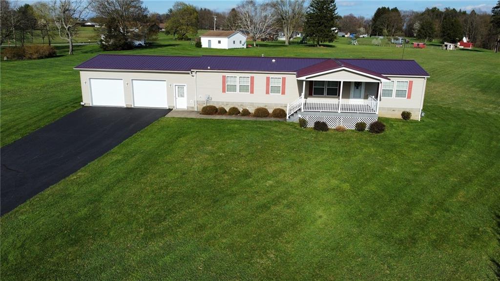 540 Maple Grove Road Rimersburg, PA 16248 - Photo 1 of 47 a front view of a house with a yard and trees